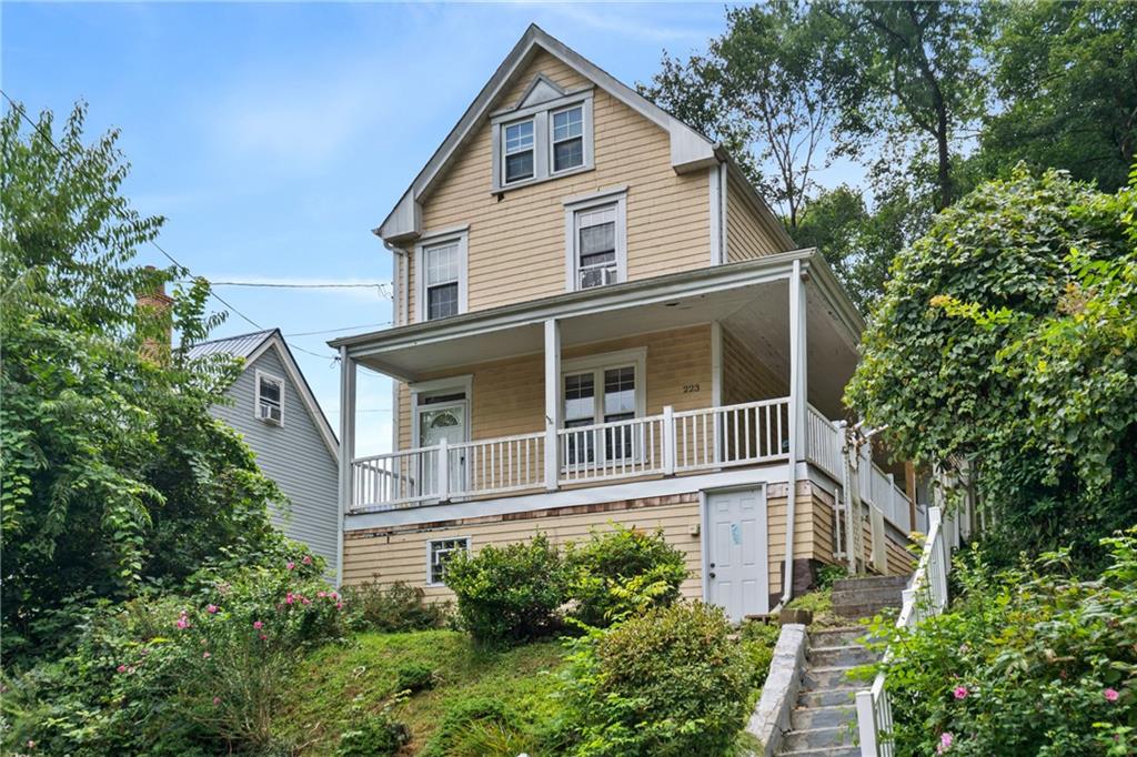 223 Hickory Street McKees Rocks, PA 15136 - Photo 2 of 27 a house view with a garden space
