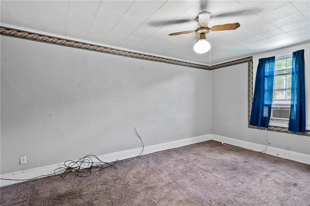 223 Hickory Street McKees Rocks, PA 15136 - Photo 23 of 27 a view of a room with window and ceiling fan