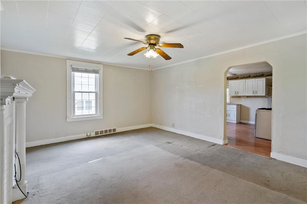 223 Hickory Street McKees Rocks, PA 15136 - Photo 8 of 27 wooden floor in an empty room with a window