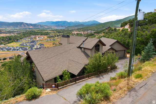 335 Bern Way Midway, UT 84049 - Photo 88 of 88 Hillside property featuring a multi-level roofline, stucco exterior, and attached garage