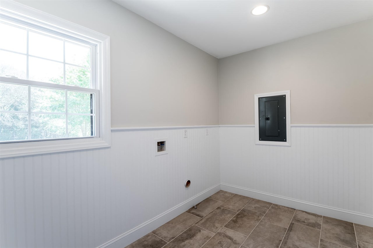 3800 Bland Road Raleigh, NC 27609 - Photo 22 of 25 Conveniently located between garage and kitchen. Plenty of room for washer/dryer and all the treasures we bring into the home. Utility Room