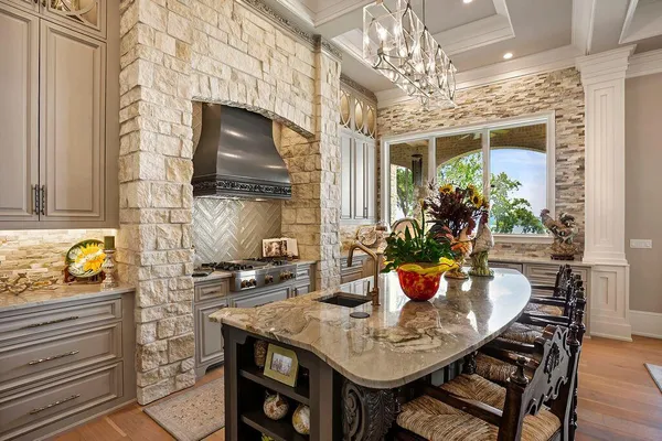 a dining room with furniture and chandelier