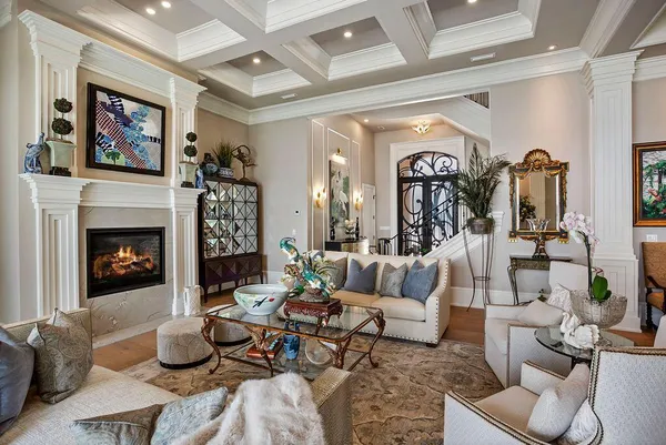 a living room with furniture fireplace and rug