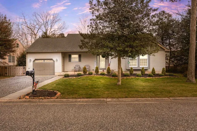a house with trees in the background