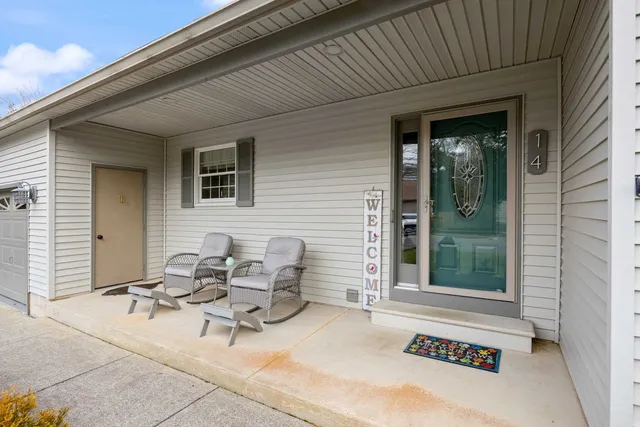 a view of a patio with table and chairs and potted plants