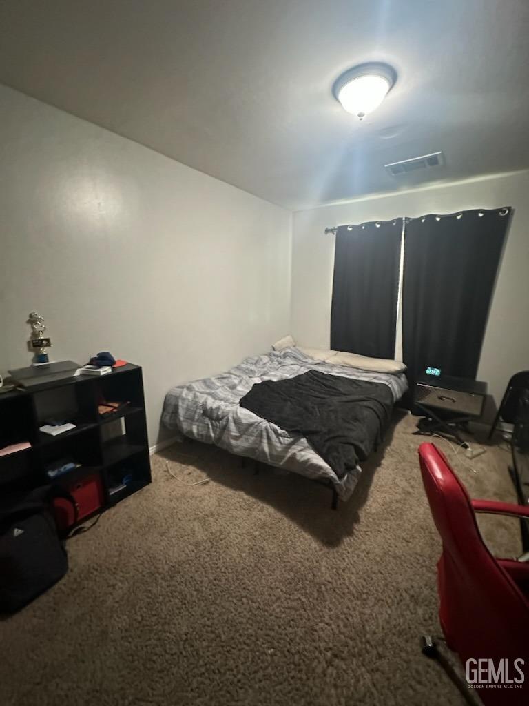 Undisclosed Address Bakersfield, CA 93313 - Photo 5 of 5 a bedroom with a bed and a desk
