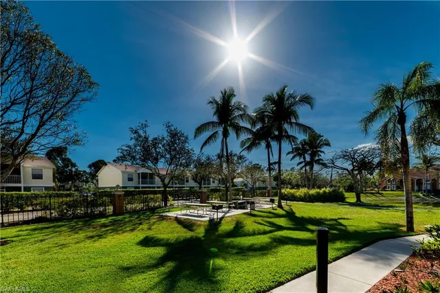 a swimming pool with outdoor seating and yard