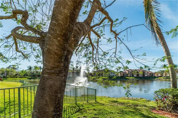 a view of a lake with a yard