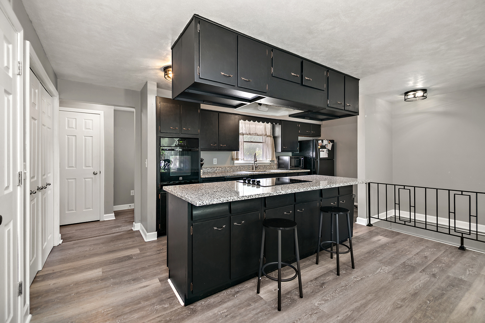 1572 North 2000E Road Bourbonnais, IL 60914 - Photo 6 of 18 a kitchen with stainless steel appliances granite countertop a stove a sink and a refrigerator