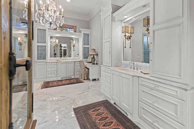 a spacious bathroom with a granite countertop sink a mirror and shower