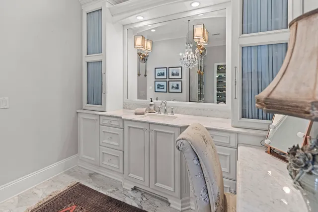 a view of walk in closet with clothes