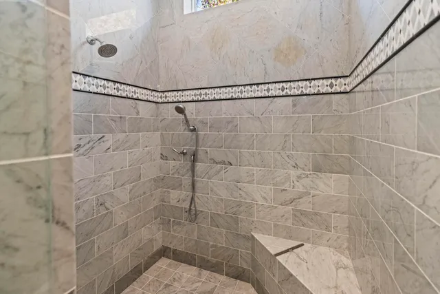 a living room with furniture wooden floor and a chandelier