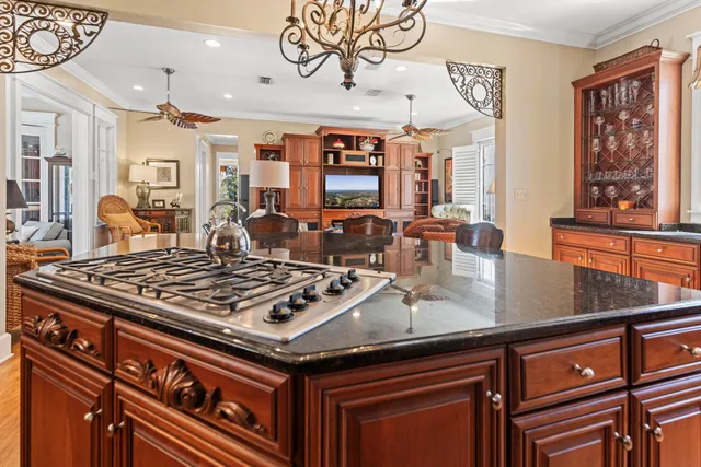 a bedroom with furniture and a large window