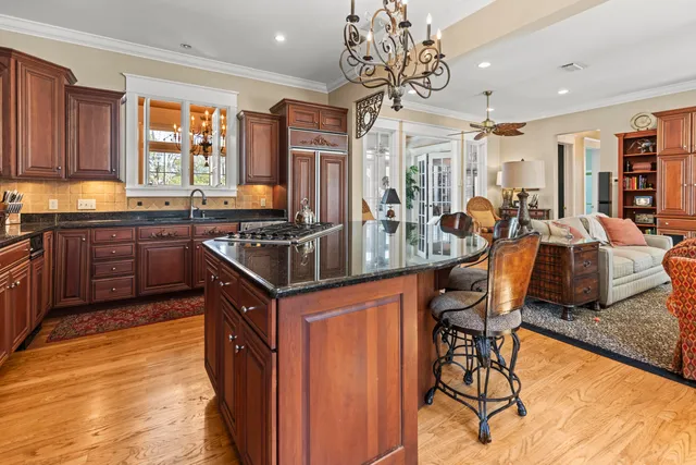 a living room filled with furniture and a floor to ceiling window
