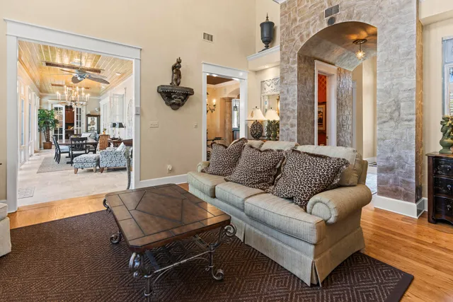 an aerial view of a house with a swimming pool and outdoor space