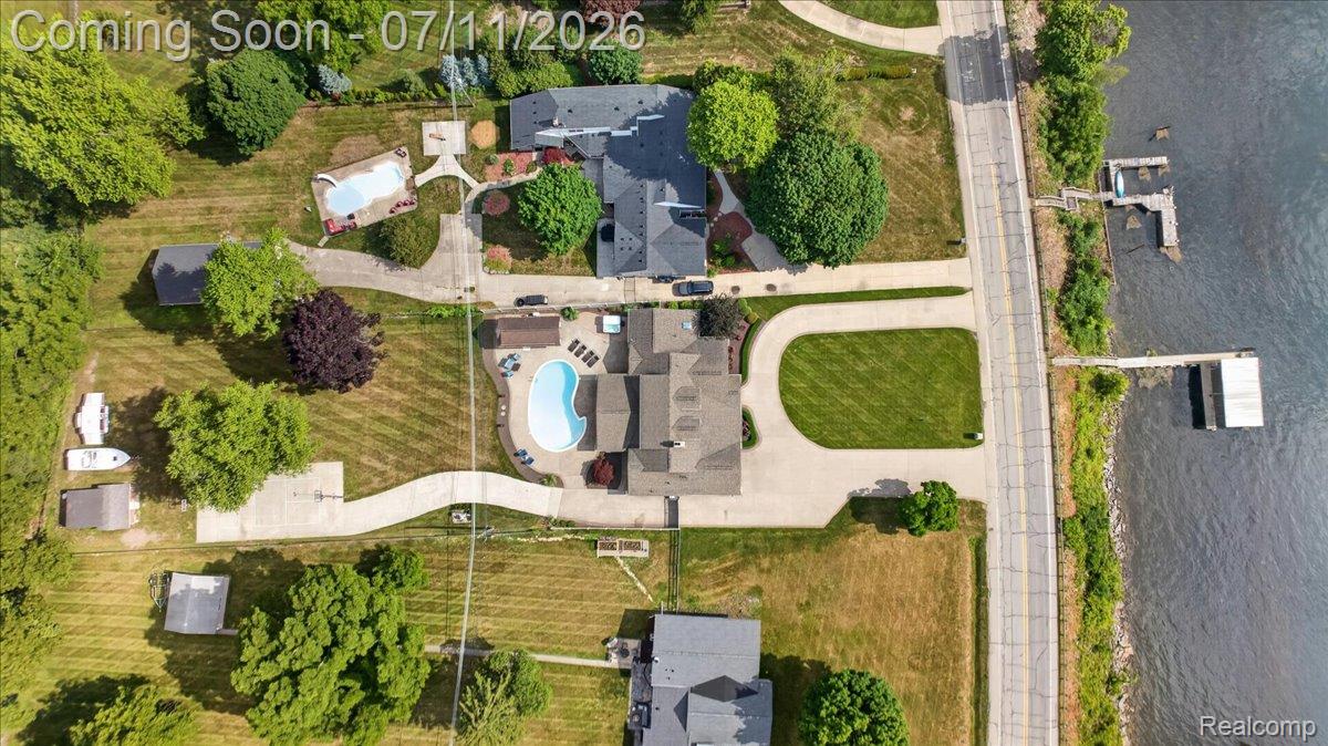 23750 East River Road Grosse Ile, MI 48138 - Photo 46 of 54 Aerial perspective showcasing multiple properties along a body of water