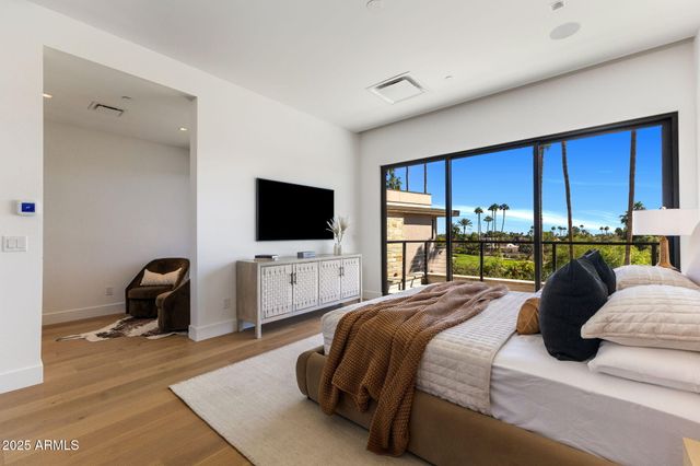 a view of a swimming pool with a patio and a yard