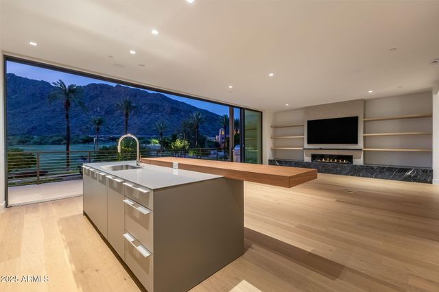 a bathroom with double sink and a mirror