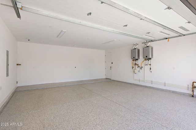 a view of swimming pool with outdoor seating and plants