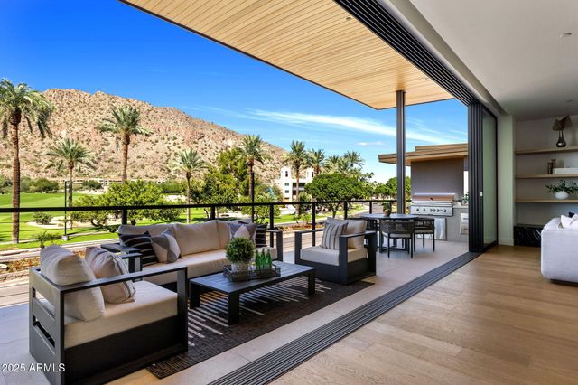 a balcony with furniture and a view of balcony