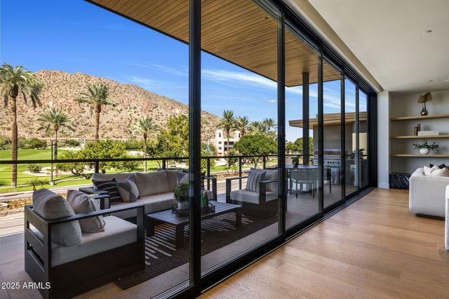 a white room with a potted plant