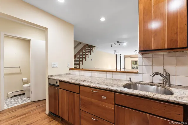 a kitchen with a sink and cabinets