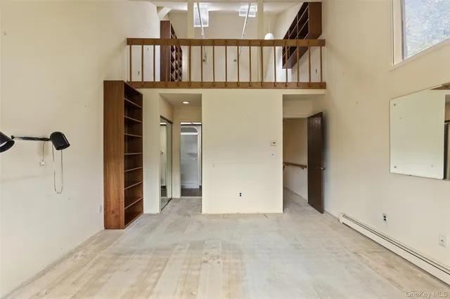 a bathroom with a granite countertop sink mirror and a shower