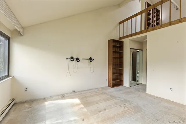 a view of a hallway with staircase