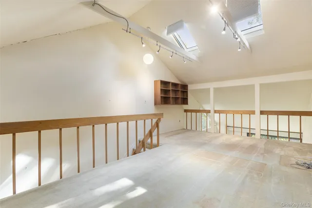 a sign that is sitting in front of a brick building