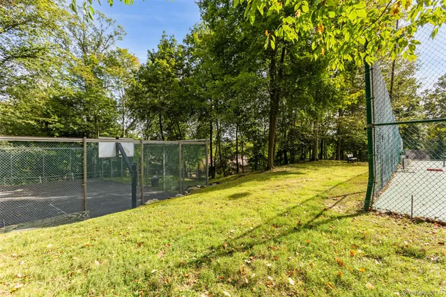 a view of a patio with table and chairs