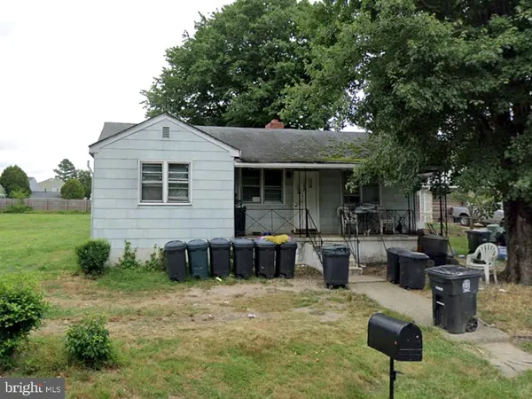 a view of a backyard with sitting area