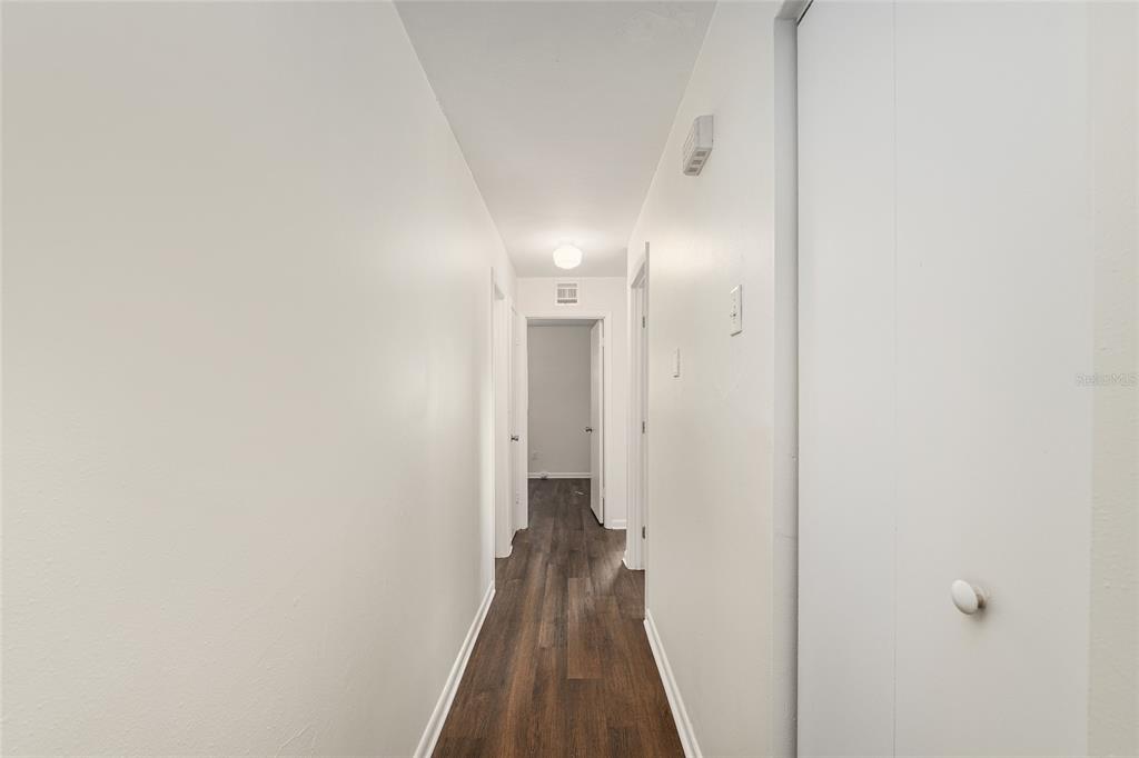 2511 Northeast 3rd Place Gainesville, FL 32641 - Photo 12 of 29 a view of a hallway with wooden floor