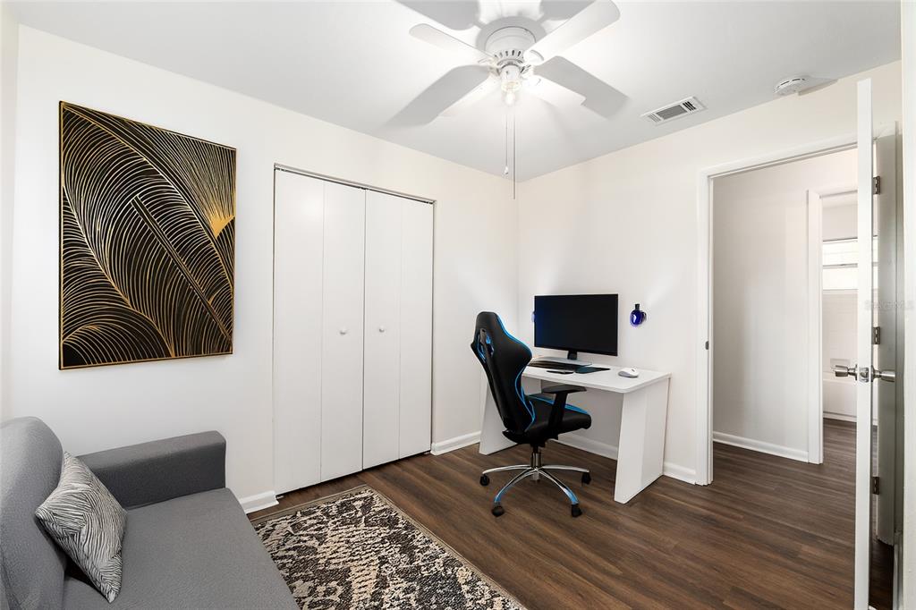 2511 Northeast 3rd Place Gainesville, FL 32641 - Photo 14 of 29 a view of a workspace with furniture and a window