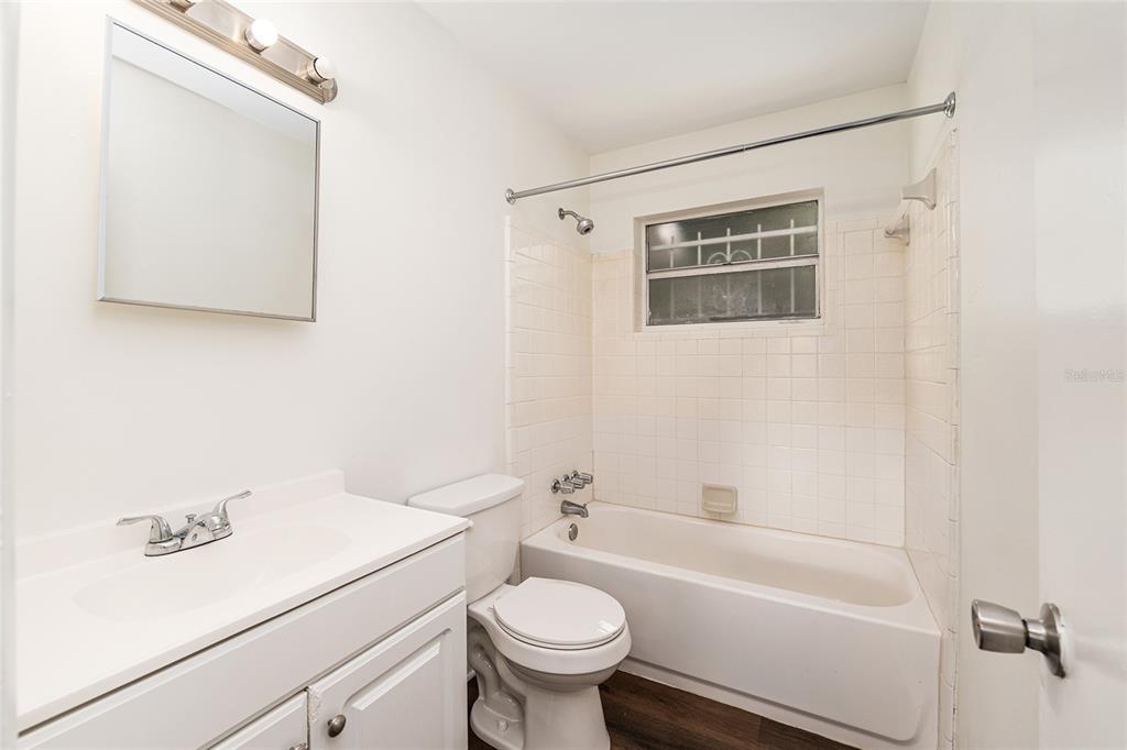 2511 Northeast 3rd Place Gainesville, FL 32641 - Photo 15 of 29 a bathroom with a sink a toilet and a bathtub