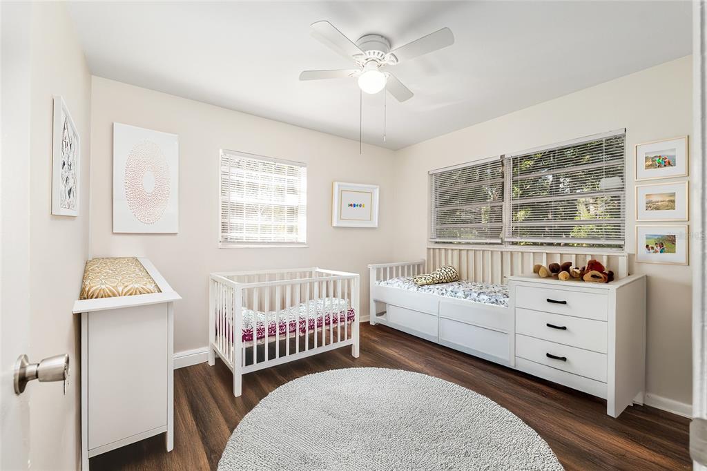 2511 Northeast 3rd Place Gainesville, FL 32641 - Photo 17 of 29 a bedroom with a bed and a window