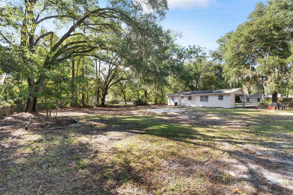 2511 Northeast 3rd Place Gainesville, FL 32641 - Photo 23 of 29 a view of a house with a yard