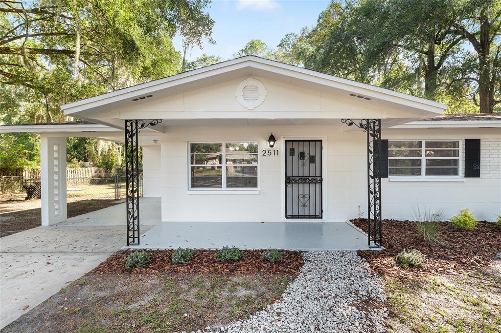 2511 Northeast 3rd Place Gainesville, FL 32641 - Photo 3 of 29 a front view of a house with a yard