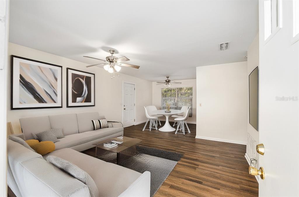 2511 Northeast 3rd Place Gainesville, FL 32641 - Photo 5 of 29 a living room with furniture and a table