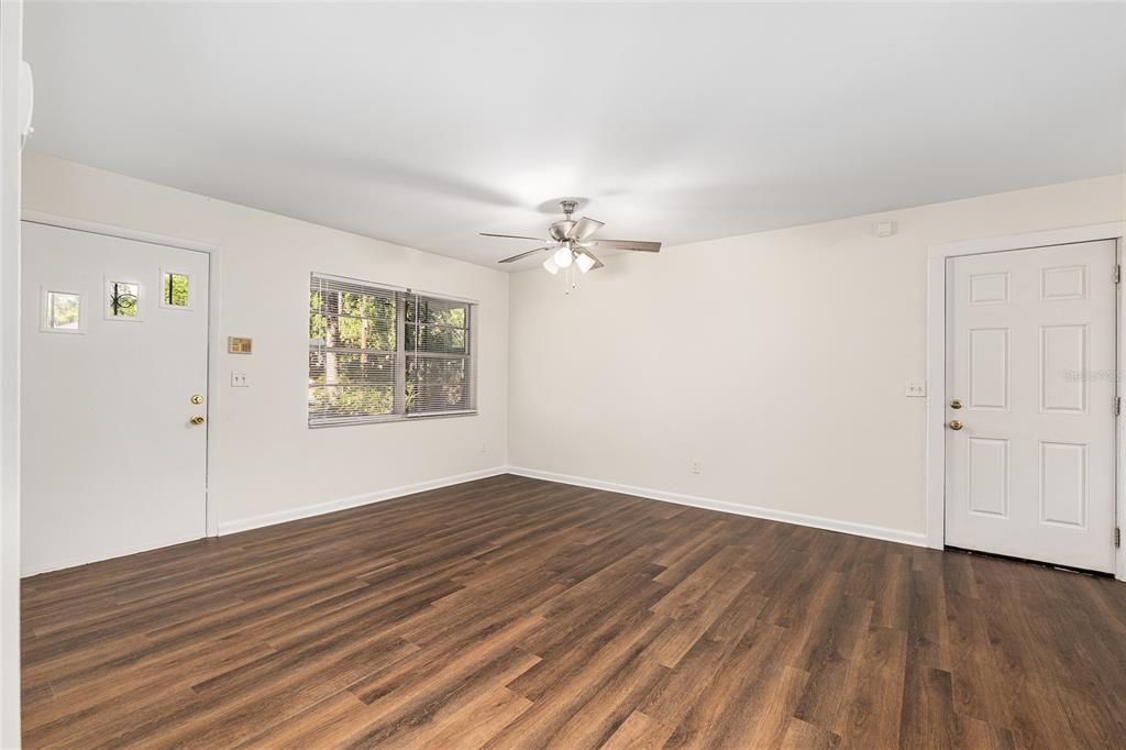 2511 Northeast 3rd Place Gainesville, FL 32641 - Photo 6 of 29 wooden floor in an empty room with a window