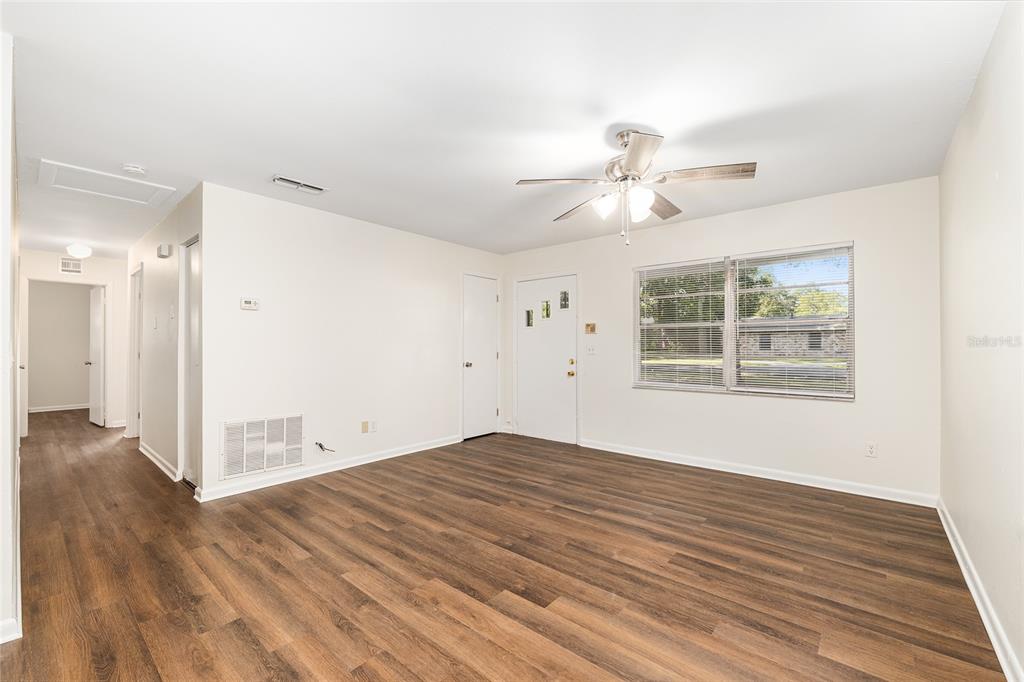 2511 Northeast 3rd Place Gainesville, FL 32641 - Photo 8 of 29 wooden floor in an empty room with a window