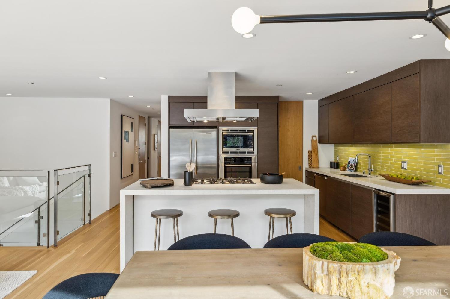 392 Eureka Street San Francisco, CA 94114 - Photo 6 of 74 a kitchen with stainless steel appliances kitchen island granite countertop a sink and cabinets