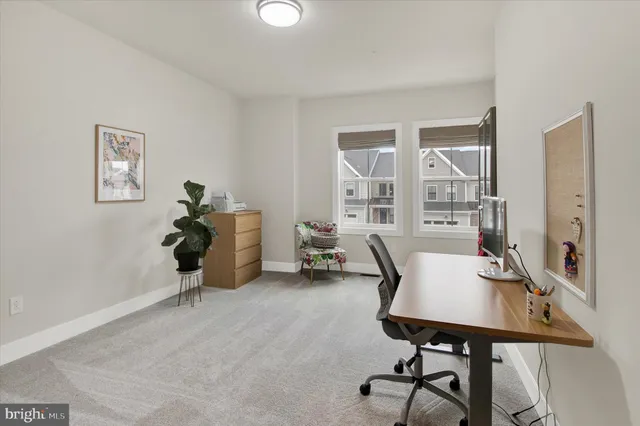 a workspace with furniture and window