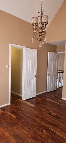 a view of a livingroom with wooden floor