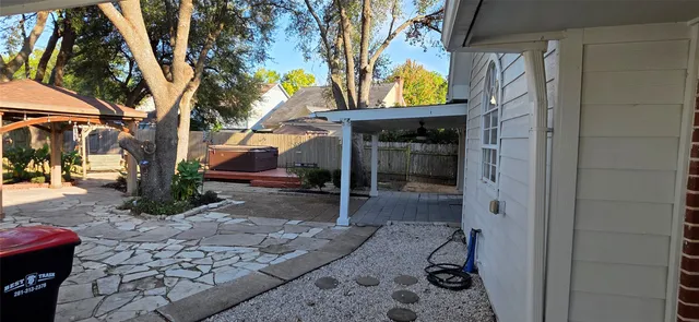 a view of a house with a patio and fire pit