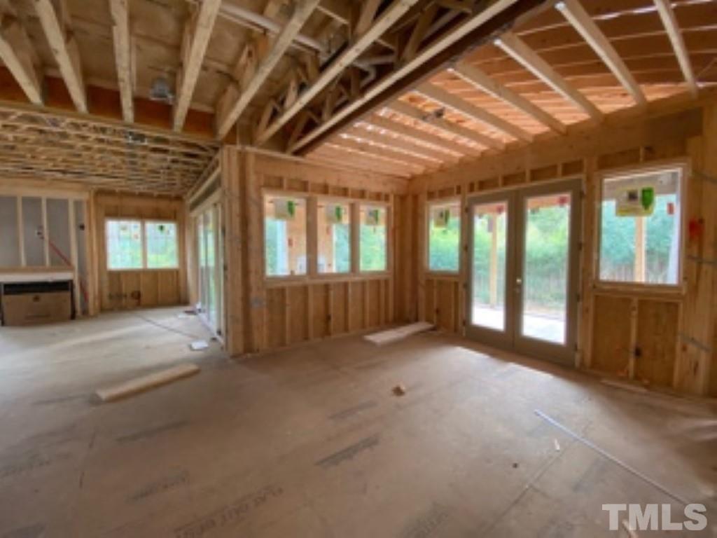 3431 Redbud Lane Raleigh, NC 27607 - Photo 5 of 11 a view of an empty room with a fireplace
