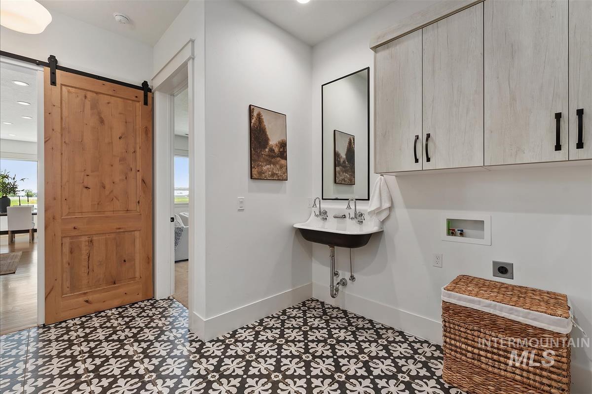 8195 Joplin Road Nampa, ID 83687 - Photo 15 of 50 Laundry area with sink. (One of three laundry areas in the home.)
