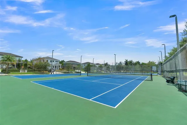 a view of an outdoor space and tennis court