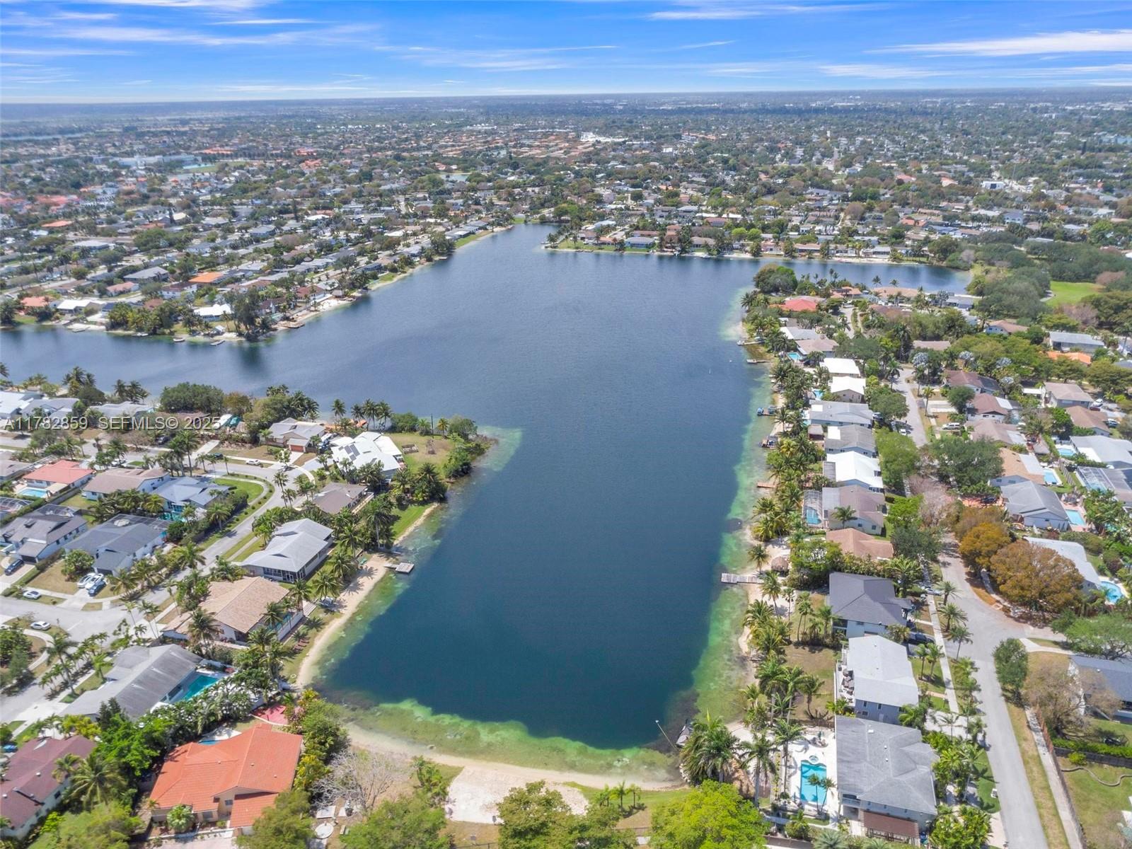 7830 Southwest 199th Terrace Cutler Bay, FL 33189 - Photo 6 of 30 an aerial view of a house with a lake view