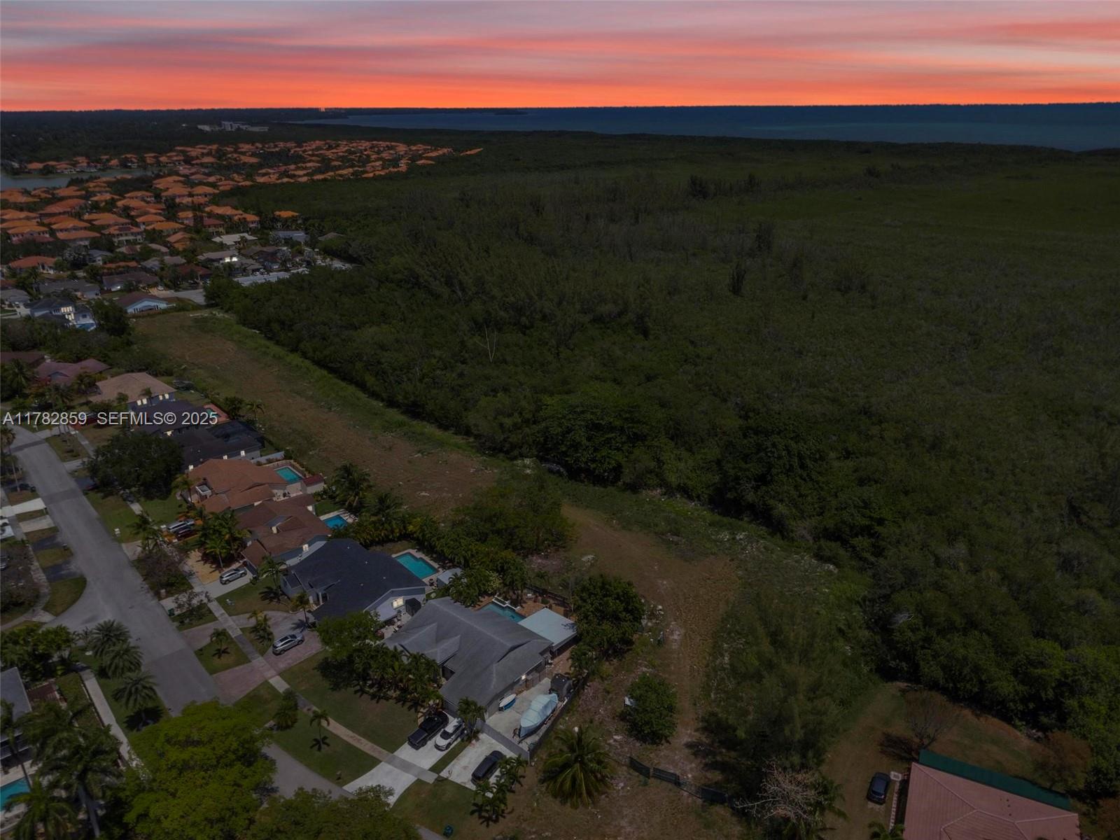 7830 Southwest 199th Terrace Cutler Bay, FL 33189 - Photo 8 of 30 a view of a city from a lake