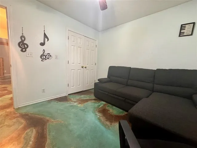 a living room with furniture and a rug